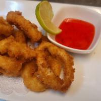 Fried Calamari Rings · Crispy -fried calamari rings with tempura batter served with sweet chili sauce.