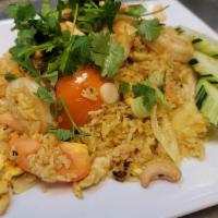 Pineapple Fried Rice · Chicken and shrimp stir-fried with rice, egg, tomato, diced carrot, green onion, onion, pine...