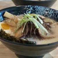 Garlic Tonkotsu · Garlic flavored pork broth with pork belly topped with egg sprouts green onion and nori.