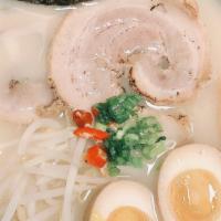 Tonkotsu Ramen · Rich pork broth topped with pork belly sprouts bamboo shoots egg and green onions.