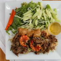 Bun Dac Biet · Special combination of grilled shrimp, pork, and egg rolls served with vermicelli. Comes wit...