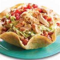 Taco Salad · Crispy baked in-house taco salad shell filled with shredded lettuce, beans, and your choice ...