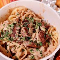 Beef Stroganoff Middle Bucket · Feeds 2-3.  1.5lbs Fettuccini Prime Sirloin Steak Tips, Mushrooms, Onions, Tossed in a Class...