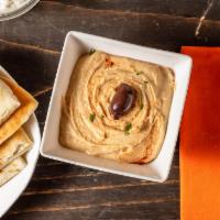 Hummus · Our traditional chickpea hummus with tahini, garlic, lemon, and paprika. Served with our fre...