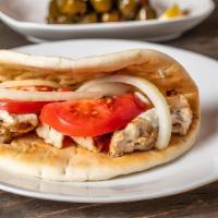 Grilled Chicken Pita · Charbroiled marinated chicken breast. Served on fresh pita bread with tomato, red onion, and...