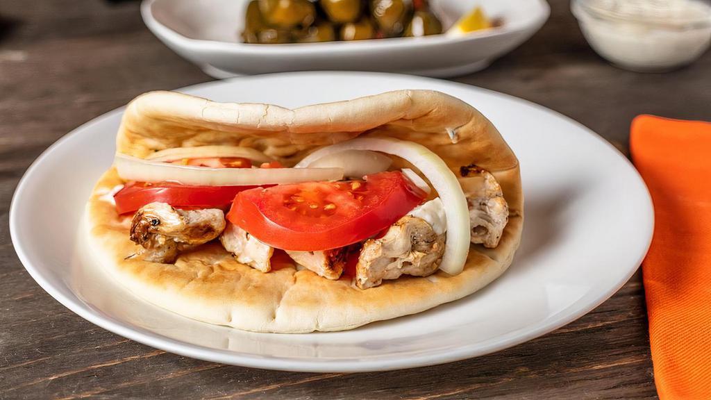 Grilled Chicken Pita · Charbroiled marinated chicken breast. Served on fresh pita bread with tomato, red onion, and tzatziki sauce.