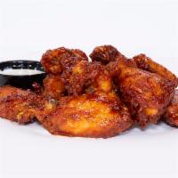 Nashville Hot Wings · Nashville style fried chicken wings dipped in fire oil and rubbed with hot Haus rub. Served ...