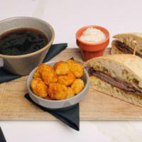 French Dip · roast beef, provolone cheese, ciabatta roll, au jus, cajun tater tots