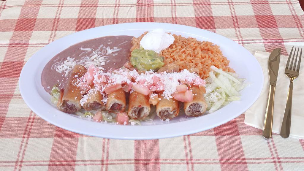 Taquitos Rancheros · Beef or chicken only. With guacamole, sour cream, rice and beans, cheese & tomato.