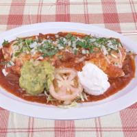 Burrito Chile Colorado · Beef burrito in red sauce with guacamole & sour cream, topped with melted cheese, onions, ci...