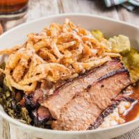 Texas Beef Brisket Bowl · Brisket served over Garlic Red-Skin Mashed Potatoes, Collard Greens and Onion Strings with R...
