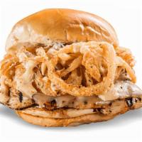 Cajun Chicken Sandwich · Grilled, Cajun-seasoned chicken topped with pepper-Jack cheese, fried Onion Strings, and rem...