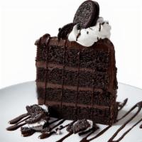 Chocolate Cookies & Cream Cake · A sky-high slice of chocolate cake with chocolate ganache layers, finished with whipped crea...