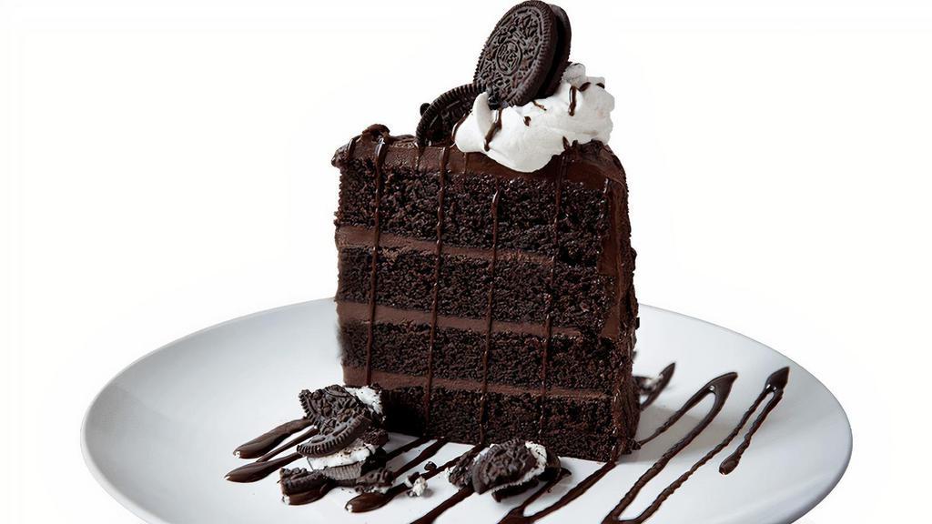 Chocolate Cookies & Cream Cake · A sky-high slice of chocolate cake with chocolate ganache layers, finished with whipped cream and crumbled OREO cookies.