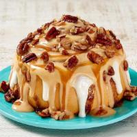 Caramel Pecanbon® · Our signature Classic Roll, topped with decadent caramel frosting and pecans for the perfect...