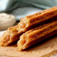 Churro Stick · Our spin on the classic beloved snack, baked to perfection and topped with our world-famous ...