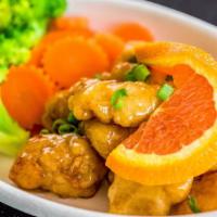 Orange Chicken · Stir fried crispy chicken with orange sauce served with steamed broccoli carrot and jasmine ...