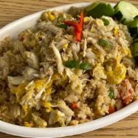 Crab Fried Rice · Stir fried rice with egg, crab meat, snow pea, carrot, onion, green onion, and tomato.