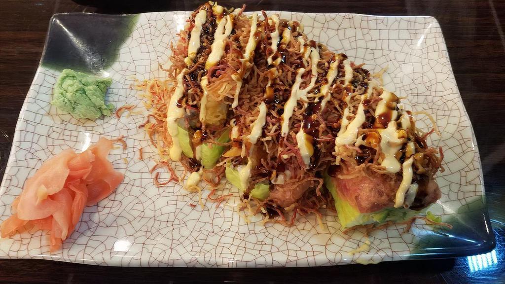Kamikaze Maki · Twin Jumbo Shrimp Tempura Rolled w. Avocado In Soy Wrapper, Topped w. Spicy Tuna Crunchy, Kani & Spicy Mayo & Eel Sauce.