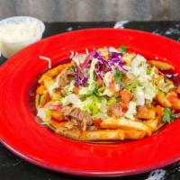 Macho Fries · Crispy fries with your choice of meat and toppings