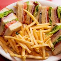 Classic Club · Turkey, ham, bacon, tomato, lettuce and mayonnaise on your choice of bread.