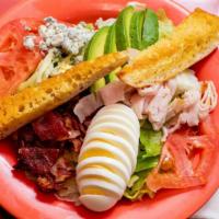 Cobb Salad · Turkey, bacon, tomatoes, avocado, hard boiled egg and crumbled bleu cheese on a bed of crisp...