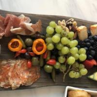 Antipasti Board · Chef selected cured meats & artisinal cheeses with fruit, honeycomb, assorted accouterments.
