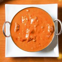 Chicken Tikka Masala · Tandoor-barbecued chicken breast cooked with bell pepper, cashew nuts, onion, ginger, garlic...