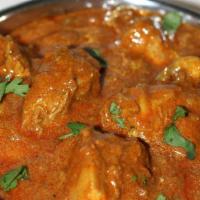 Chicken Curry · Boneless chicken thigh chops cooked with onions, ginger, garlic, cilantro, fresh tomatoes, a...