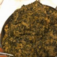 Chicken Saag · Boneless chicken thigh chops cooked with spinach, onions, ginger-garlic, red and green peppe...