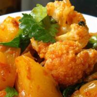 Aaloo Gobi · Vegan. Cauliflower and potato cooked with onion, ginger, garlic, cilantro, fresh tomato, and...