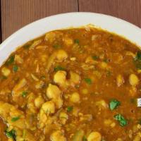 Chana Masala · Vegan. Garbanzo beans cooked with onion, ginger, garlic, fresh tomato and himalayan spices.