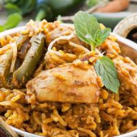 Chicken Briyani · Basmati rice cooked with chicken thigh chops, mint, yogurt, onions, ginger, garlic, red and ...
