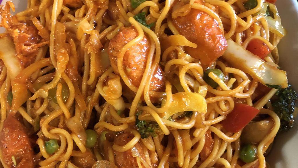 Chicken Noodles · Steamed noodles, fried chicken, ginger, onion, salt, turmeric powder, olive oil, cumin powder, cabbage, carrot, red and green peppers, and house spices.