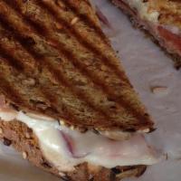 Turkey Panini · Turkey, provolone cheese, pesto mayo, tomato, red onion on ciabatta bread.