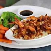 Grilled Salmon · Grilled, blackened, or bourbon-glazed, served over rice. With two sides. Grilled: 630 cal., ...
