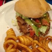 Deluxe Cheeseburger · Toasted sesame-seed bun with lettuce, tomato, 1/4 pound beef patty and cheese. Onions and/or...