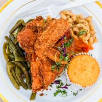 Louella'S Fried Chicken · 2 pieces of fried chicken along with 2 sides of the day and a cornbread muffin