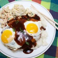 Loco Moco · Favorite Hawaiian breakfast. Ground beef patty smothered in brown gravy over a bed of rice w...