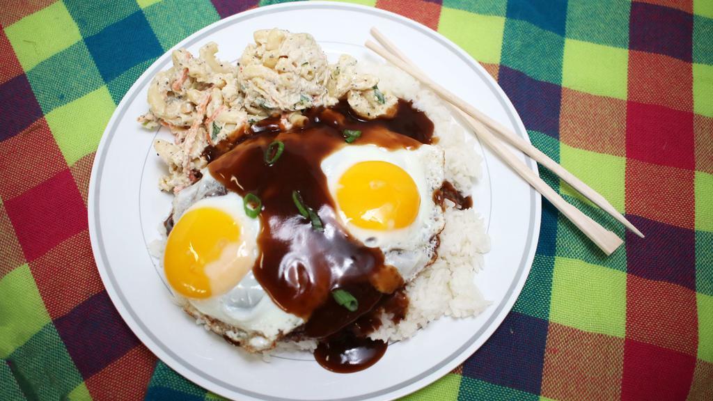 Loco Moco · Favorite Hawaiian breakfast. Ground beef patty smothered in brown gravy over a bed of rice with 2 sunny-side eggs on top and a scoop of mac salad.