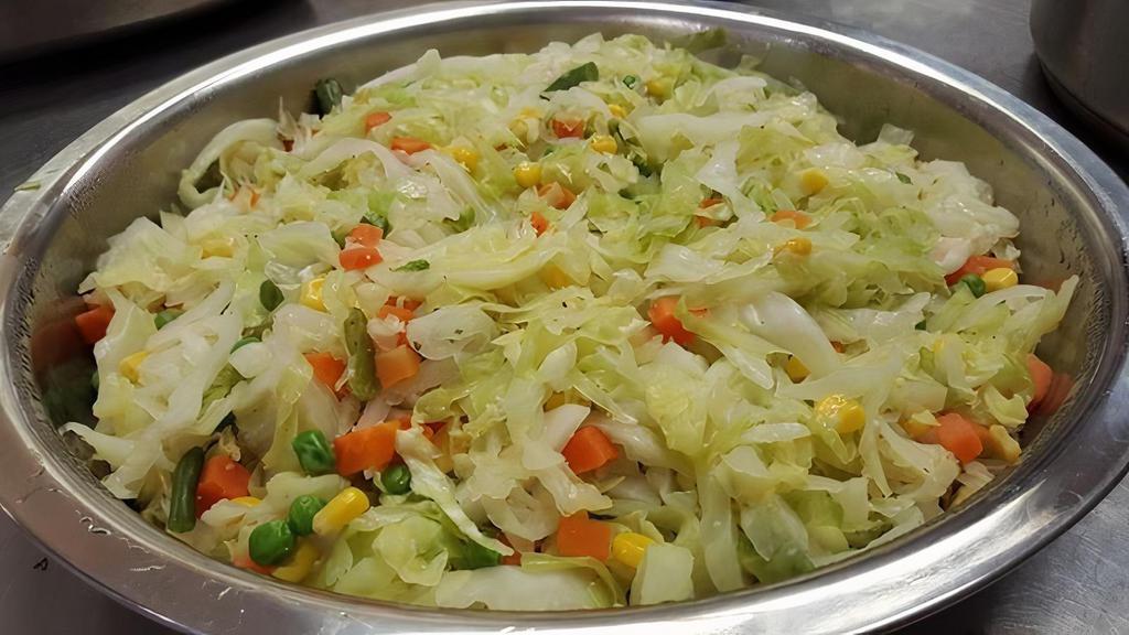Cabbage/Mixed Vegetables · Cabbage, carrots and bell peppers saute.