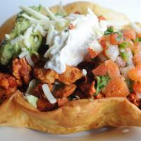 El Taco Salad · Crispy shell with lettuce rice beans and your choice of meat topped with sour cream guacaMol...