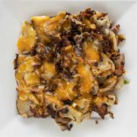Garbage Hash · Locals favorite. A mountain of hash browns with ham, bacon, onions, green peppers, and mushr...