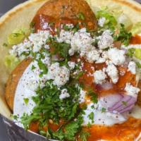 Falafel Gyro · Romaine Lettuce, Tomato, Onion, Feta cheese, Chopped Parsley, Tzatziki or Hummus, Homemade g...