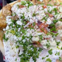 Chicken Gyro · Romaine Lettuce, Tomato, Onion, Feta cheese, Chopped Parsley, Tzatziki, Homemade garlic sauc...