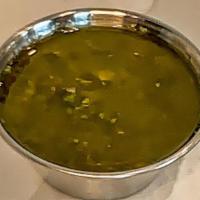 Side Chimichurri · 2 oz side of Chimichurri. An herbaceous sauce with parsley, oregano, cilantro and capers. Ve...