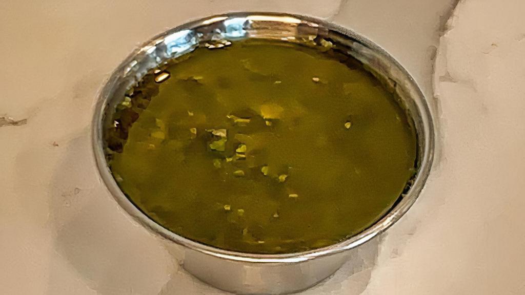 Side Chimichurri · 2 oz side of Chimichurri. An herbaceous sauce with parsley, oregano, cilantro and capers. Vegan and Gluten Free.