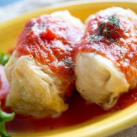 Pork And Rice Stuffed Cabbage · Two stuffed cabbage rolls with pork and rice, topped with house tomato sauce served with 1 s...