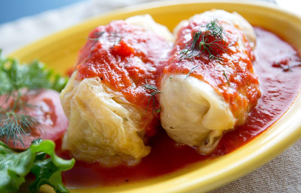 Pork And Rice Stuffed Cabbage · Two stuffed cabbage rolls with pork and rice, topped with house tomato sauce served with 1 side