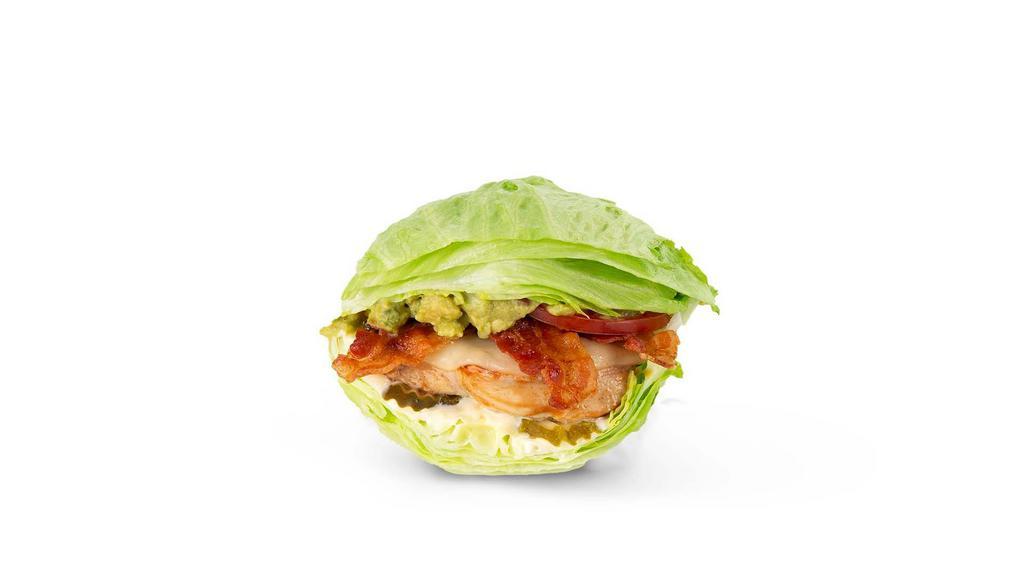 Cali Chicken Lettuce Wrap · Grilled chicken, house-made guac, hardwood-smoked bacon, Provolone, pickles, lettuce, tomatoes and mayo in a lettuce wrap.